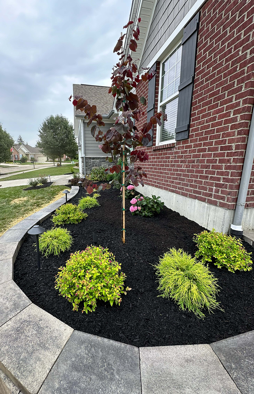 Landscaping services project with polished outdoor beds and property enhancements in Southwest Ohio